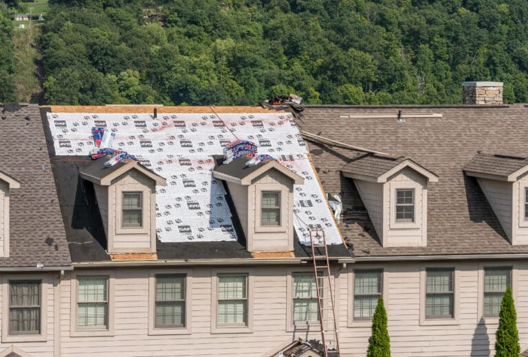 Townhouse roof after removal of the old shingles ready for reroofing